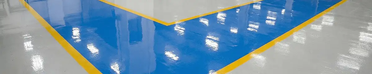A factory floor professionally covered and marked with epoxy flooring in Fort Collins, CO