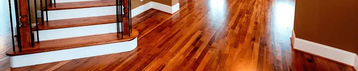 Base floor of a staircase with professionally restored wood flooring in Fort Collins CO