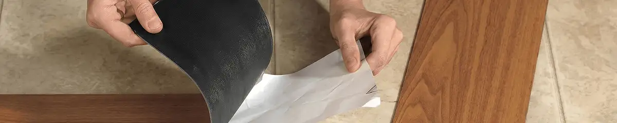 A professional installing vinyl flooring in Fort Collins, CO