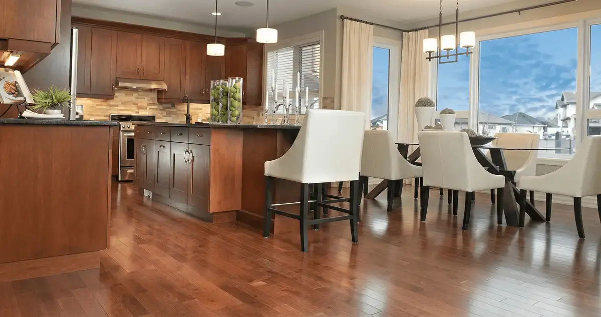 A modern kitchen with professionally installed wood flooring in Fort Collins, CO